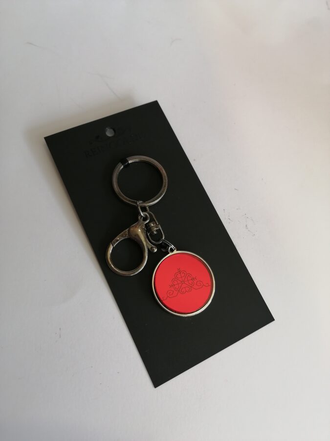 Atslēgu piekariņš ar organisko stiklu- sarkans- Saules zīme