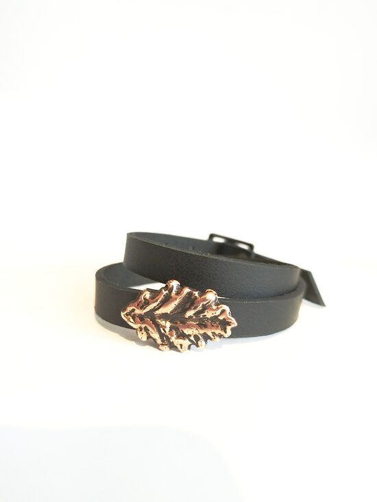 Ādas aproce ar bronzas ozzollapu